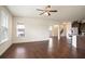 A large, light-filled living room features wood floors and multiple windows to let in natural light at 2463 Turnbury Glen Walk, Snellville, GA 30078
