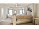 A spacious main bedroom features a tray ceiling, decorative columns, and a sitting area at 2463 Turnbury Glen Walk, Snellville, GA 30078