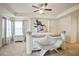 A stylish main bedroom features tray ceilings, decorative columns, and unique decor at 2463 Turnbury Glen Walk, Snellville, GA 30078