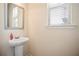 A practical and stylish powder room that has a sink and a mirror at 2463 Turnbury Glen Walk, Snellville, GA 30078