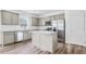 Modern kitchen with stainless steel appliances, granite countertops, and a center island for cooking at 3639 Olive Grove Ln, Covington, GA 30016