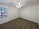 Clean bedroom with carpet flooring and view of exterior at 4028 Elm Trace Dr, Loganville, GA 30052