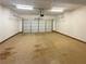 Spacious garage with an automatic door and ample space for vehicles and storage at 4028 Elm Trace Dr, Loganville, GA 30052