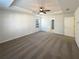 Bright main bedroom boasts ample space, neutral colored walls, and a ceiling fan at 4028 Elm Trace Dr, Loganville, GA 30052