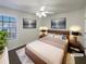 Tastefully staged main bedroom featuring a modern bed frame and complementary artwork at 4028 Elm Trace Dr, Loganville, GA 30052