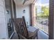 Relaxing balcony featuring rocking chairs with neighborhood views and fan at 1133 Church Se St # 2, Covington, GA 30014