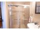Bathroom featuring a tiled shower with glass doors and modern fixtures and finishes at 1133 Church Se St # 2, Covington, GA 30014