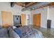 Comfortable bedroom with polished concrete floor, multiple closets, ceiling fan, and modern finishes at 1133 Church Se St # 2, Covington, GA 30014