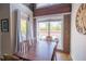 Bright dining area with large windows, exposed brick and seating for six at 1133 Church Se St # 2, Covington, GA 30014