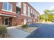 Brick building exterior with parking and sidewalk landscaping at 1133 Church Se St # 2, Covington, GA 30014