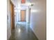 Long hallway with an exit sign and wood doors at 1133 Church Se St # 2, Covington, GA 30014