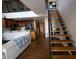Open floor plan showing staircase to the loft, kitchen, and comfortable living area at 1133 Church Se St # 2, Covington, GA 30014