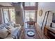 Comfortable living room featuring balcony access, dining area, and ample natural light at 1133 Church Se St # 2, Covington, GA 30014
