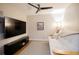 Relaxing media room with a comfortable couch, large flat screen tv and natural light at 1133 Church Se St # 2, Covington, GA 30014