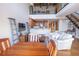 Open living area featuring a loft, modern staircase, kitchen bar, and comfortable seating at 1133 Church Se St # 2, Covington, GA 30014