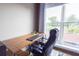 Bright office space features a large window with natural light and wood desk at 1133 Church Se St # 2, Covington, GA 30014