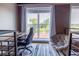 Office space featuring a large window, exposed brick, a desk, and comfortable seating at 1133 Church Se St # 2, Covington, GA 30014
