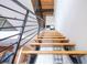 Modern staircase with wooden steps and black metal railing at 1133 Church Se St # 2, Covington, GA 30014