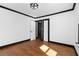 Cozy bedroom featuring hardwood floors, neutral walls, and classic trim details at 1802 S Gordon Sw St, Atlanta, GA 30310