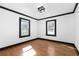 Bright bedroom with hardwood floors and two windows providing natural light at 1802 S Gordon Sw St, Atlanta, GA 30310
