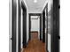 Hallway with hardwood floors and classic trim work showcasing the house's character at 1802 S Gordon Sw St, Atlanta, GA 30310