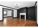 Spacious living room featuring hardwood floors, a fireplace, and an open layout at 1802 S Gordon Sw St, Atlanta, GA 30310