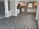 Modern kitchen with stainless steel appliances, white cabinets, and stone countertops at 5718 Denson Blvd, Morrow, GA 30260