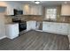Beautiful kitchen with new stainless steel appliances, granite countertops and stone backsplash at 5718 Denson Blvd, Morrow, GA 30260