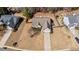 Aerial view of a single-story home with a well-maintained lawn, an attached two-car garage, and a long driveway at 7350 Brassfield Dr, Cumming, GA 30041