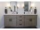 Elegant bathroom with double sinks, modern fixtures, and granite countertops at 7350 Brassfield Dr, Cumming, GA 30041