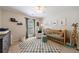 Bedroom with soft hues, plush rug, and giraffe statue, creating a peaceful and playful environment at 7350 Brassfield Dr, Cumming, GA 30041