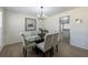 Dining room with a chandelier and seating for six at 7350 Brassfield Dr, Cumming, GA 30041