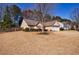 Attractive single-story home featuring a spacious front yard, an attached two-car garage, and tidy landscaping at 7350 Brassfield Dr, Cumming, GA 30041