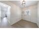 Welcoming foyer with light, neutral walls, featuring hardwood floors, and decorative wall molding at 7350 Brassfield Dr, Cumming, GA 30041