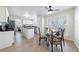 Eat-in kitchen area features a glass-top dining table with seating and a bright, natural light at 7350 Brassfield Dr, Cumming, GA 30041