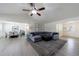 Cozy living room with comfortable seating, a ceiling fan, and a view of the dining area at 7350 Brassfield Dr, Cumming, GA 30041