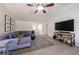 Inviting living room featuring a sectional sofa and a mounted television at 7350 Brassfield Dr, Cumming, GA 30041