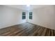 Bedroom featuring modern flooring, two large windows and plenty of natural light at 175 Stillwood Dr, Fayetteville, GA 30215