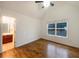 Bright bedroom with hardwood floors, vaulted ceiling, and large window at 175 Stillwood Dr, Fayetteville, GA 30215