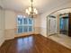 Formal dining room with natural light, chandelier and wood trim throughout at 175 Stillwood Dr, Fayetteville, GA 30215