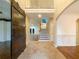 Entry foyer with high ceilings, tile flooring, staircase, and an arched doorway at 175 Stillwood Dr, Fayetteville, GA 30215