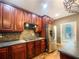 Kitchen area with stainless appliances, granite countertops and wood cabinets at 175 Stillwood Dr, Fayetteville, GA 30215