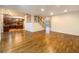 Open-concept living room boasts hardwood floors, stairs, and access to kitchen at 175 Stillwood Dr, Fayetteville, GA 30215