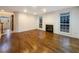 Spacious living room with a fireplace, hardwood floors, and natural light at 175 Stillwood Dr, Fayetteville, GA 30215