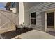 Cozy back patio area with seating and a wooden fence for privacy at 5620 Berney Cir, Powder Springs, GA 30127