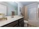Bathroom with a marble counter and a tub and shower combo at 5620 Berney Cir, Powder Springs, GA 30127