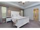 This main bedroom features neutral walls, carpeted flooring, and tray ceilings at 5620 Berney Cir, Powder Springs, GA 30127