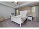 Bright main bedroom with neutral walls, tray ceiling, and furnishings at 5620 Berney Cir, Powder Springs, GA 30127