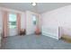 Charming Bedroom with pink walls, plush carpeting, and a white crib near two windows at 5620 Berney Cir, Powder Springs, GA 30127