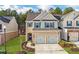 Charming two-story home with a brick facade, two-car garage and blue shutters at 5620 Berney Cir, Powder Springs, GA 30127